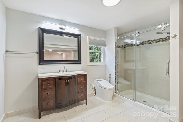 3009 Brooks Mill Ln, Wingate, NC 28174 - full bath featuring toilet, a stall shower, vanity, and tile patterned floors