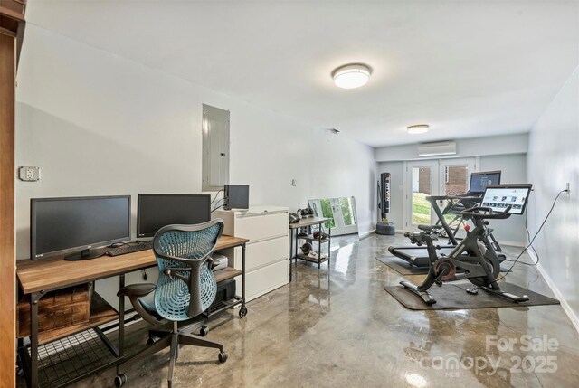 3009 Brooks Mill Ln, Wingate, NC 28174 - office space with a wall mounted AC, electric panel, concrete flooring, and baseboards