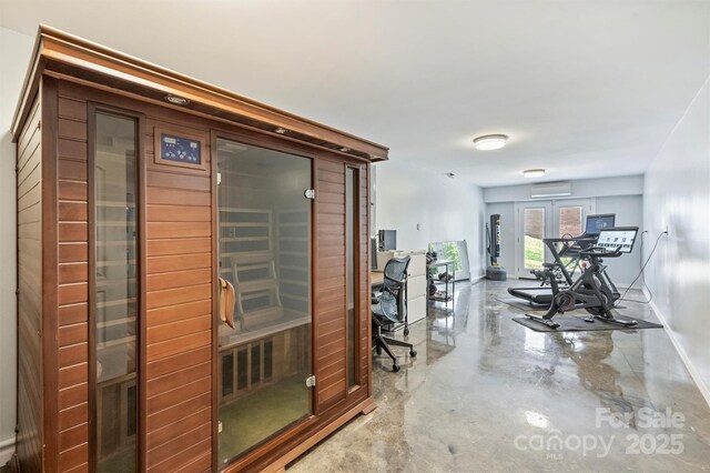 3009 Brooks Mill Ln, Wingate, NC 28174 - hallway with a sauna, a wall mounted air conditioner, a desk, baseboards, and french doors