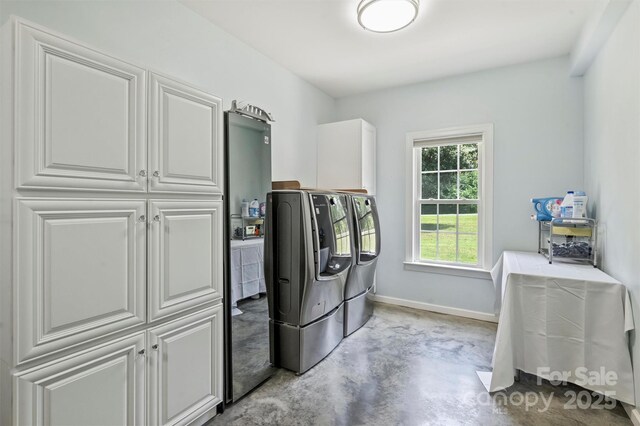 3009 Brooks Mill Ln, Wingate, NC 28174 - washroom with washing machine and dryer, cabinet space, and baseboards