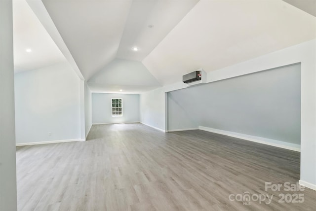 3009 Brooks Mill Ln, Wingate, NC 28174 - additional living space with lofted ceiling, wood finished floors, baseboards, and recessed lighting