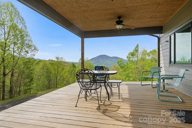 630 Graybeal Holw, Creston, NC 28615 - wooden terrace featuring ceiling fan, outdoor dining space, and a mountain view