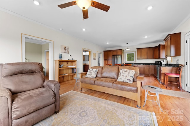 630 Graybeal Holw, Creston, NC 28615 - living room with light wood-type flooring, crown molding, ceiling fan, and recessed lighting