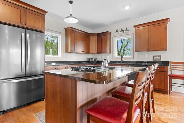 630 Graybeal Holw, Creston, NC 28615 - kitchen featuring stainless steel appliances, healthy amount of natural light, light wood finished floors, and ornamental molding