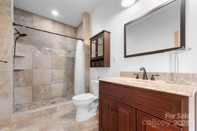 630 Graybeal Holw, Creston, NC 28615 - full bathroom with toilet, a tile shower, and vanity