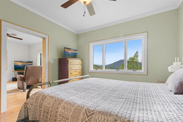 630 Graybeal Holw, Creston, NC 28615 - bedroom with wood finished floors, ornamental molding, and ceiling fan