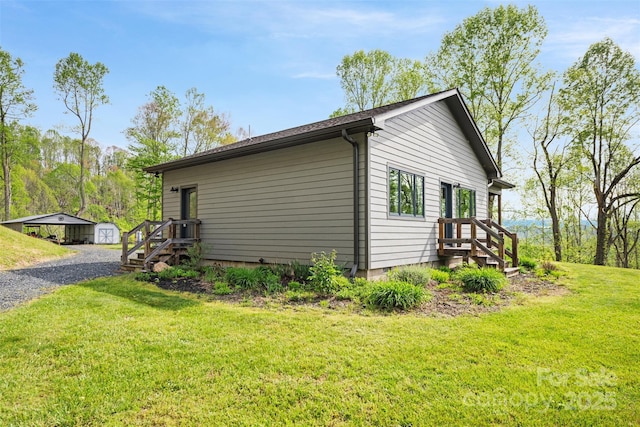 630 Graybeal Holw, Creston, NC 28615 - view of home's exterior with crawl space, an outbuilding, and a yard