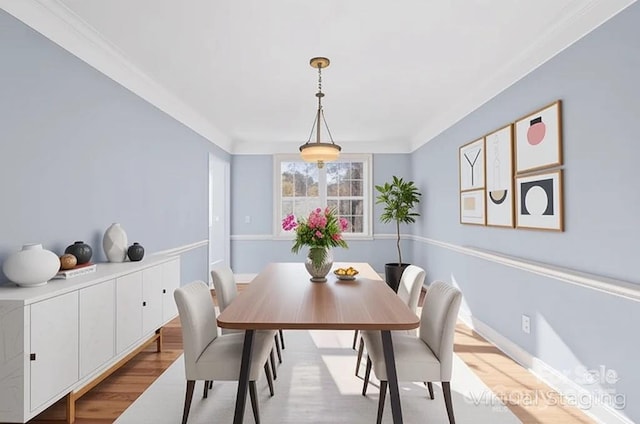 dining space featuring wood finished floors