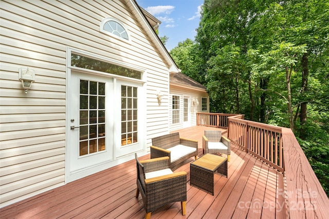 deck featuring outdoor lounge area