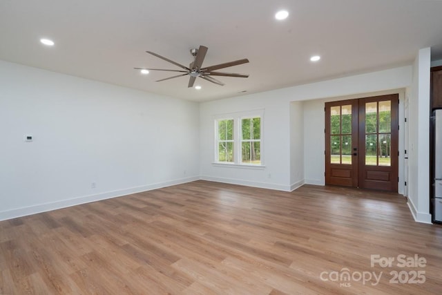 interior space with light wood-style floors, ceiling fan, french doors, and recessed lighting
