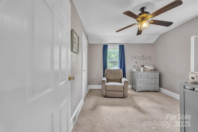living area with carpet flooring, ceiling fan, and baseboards