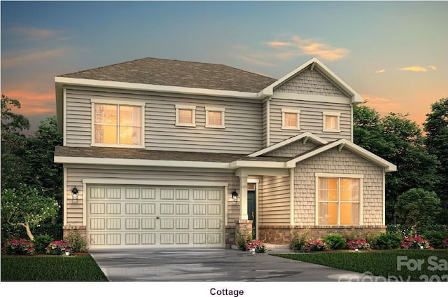 view of front facade featuring a garage, concrete driveway, and stone siding