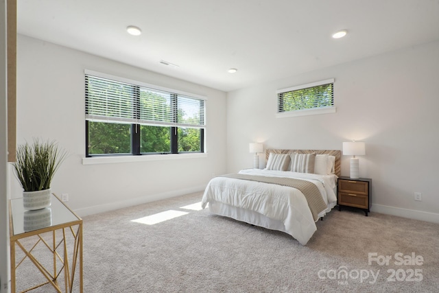 carpeted bedroom with baseboards and recessed lighting