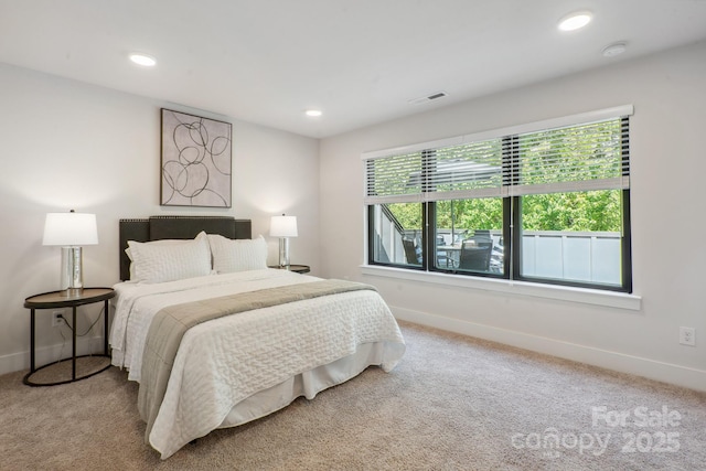 carpeted bedroom with baseboards and recessed lighting