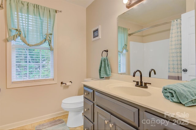 bathroom with tile patterned flooring, vanity, toilet, baseboards, and a shower with curtain