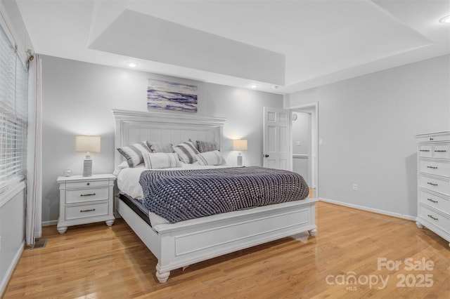 bedroom with recessed lighting, baseboards, and light wood-style flooring