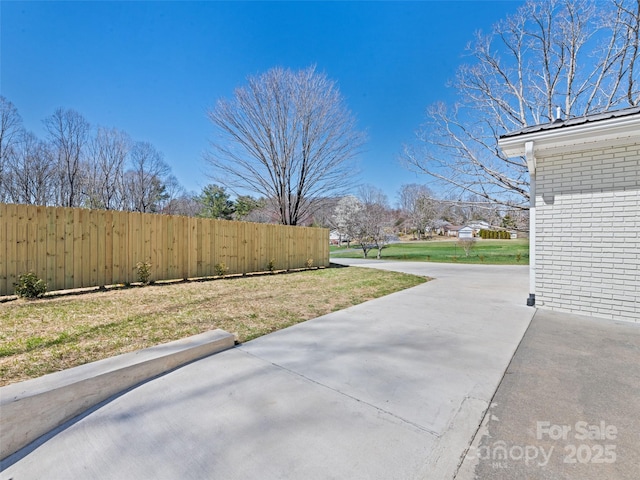 view of patio featuring fence