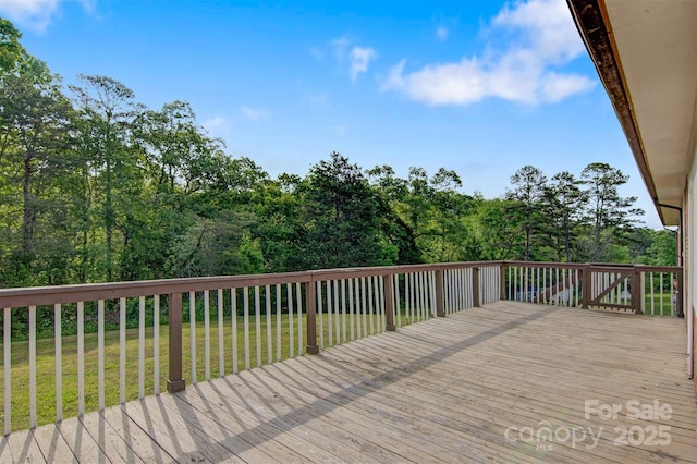 wooden deck with a yard