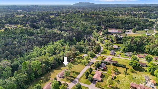 drone / aerial view with a view of trees