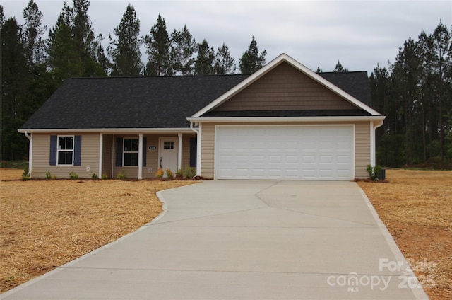 single story home with an attached garage and concrete driveway