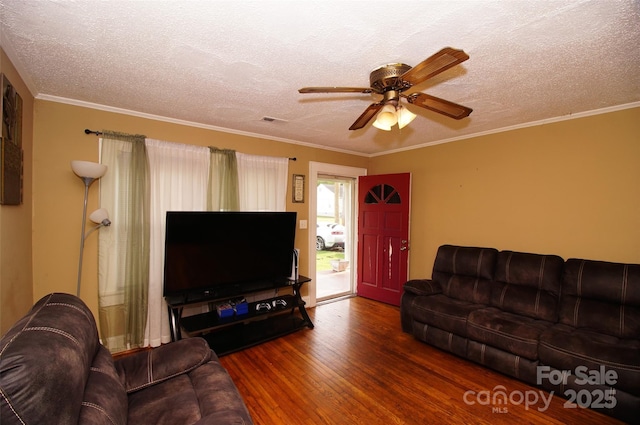 615 Mauney Ave, Kings Mountain, NC 28086 - living area featuring a textured ceiling, wood finished floors, a ceiling fan, and visible vents