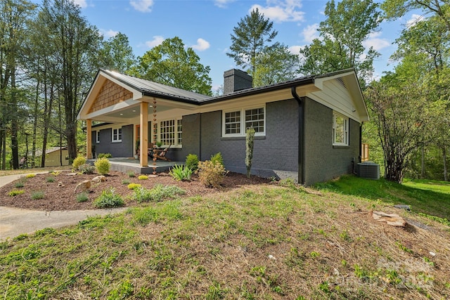 75 White Pine Dr, Fletcher, NC 28732 - exterior space featuring a patio area, a front yard, a chimney, and cooling unit