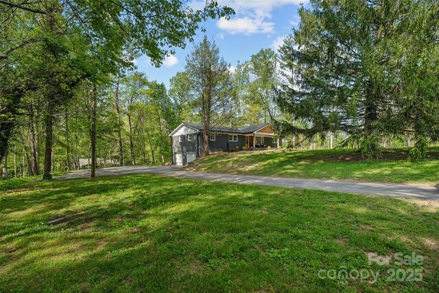 75 White Pine Dr, Fletcher, NC 28732 - ranch-style house with a garage, aphalt driveway, and a front yard