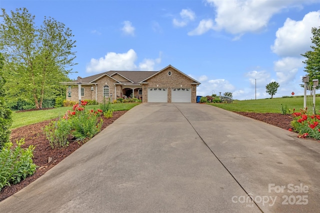 5507 Land Harbour Dr, Granite Falls, NC 28630 - view of front of house featuring an attached garage, concrete driveway, brick siding, and a front lawn
