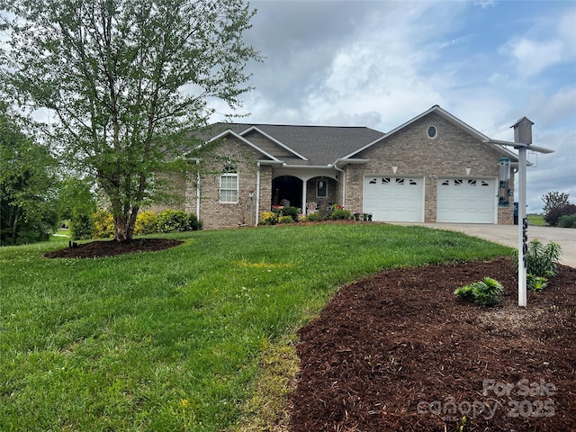 5507 Land Harbour Dr, Granite Falls, NC 28630 - view of front of home featuring an attached garage, a front lawn, driveway, and brick siding