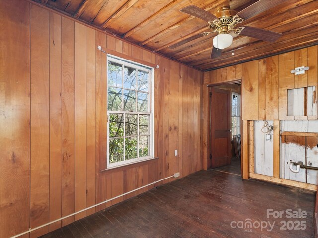 40 Wells Rd, Waynesville, NC 28785 - empty room with wood ceiling, wooden walls, a healthy amount of sunlight, and hardwood / wood-style flooring