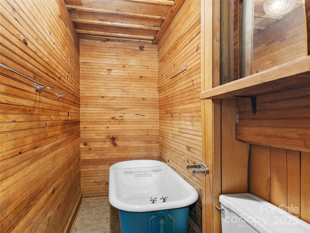 40 Wells Rd, Waynesville, NC 28785 - bathroom with wooden walls, toilet, and a freestanding tub
