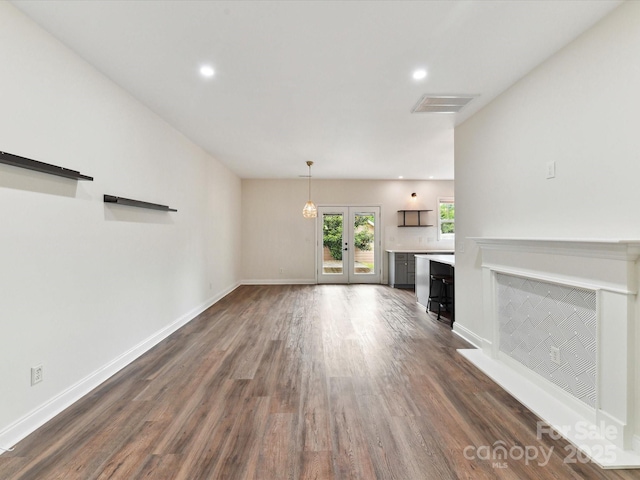 240 Faust Rd, Davidson, NC 28036 - unfurnished living room featuring dark wood-type flooring, baseboards, recessed lighting, and french doors