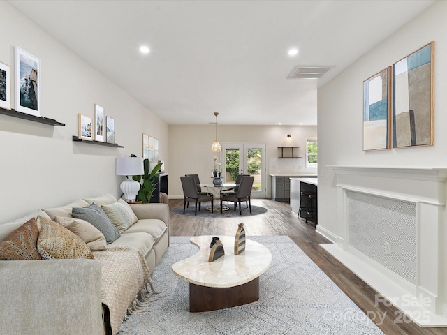 240 Faust Rd, Davidson, NC 28036 - living area with healthy amount of natural light, dark wood-style floors, recessed lighting, and baseboards