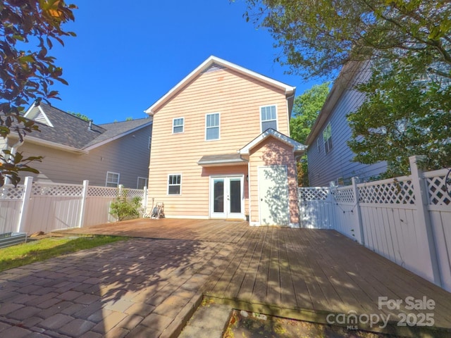240 Faust Rd, Davidson, NC 28036 - rear view of house with french doors, a deck, and a fenced backyard