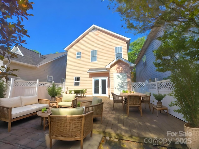 240 Faust Rd, Davidson, NC 28036 - rear view of house with french doors, outdoor dining area, an outdoor hangout area, and a deck