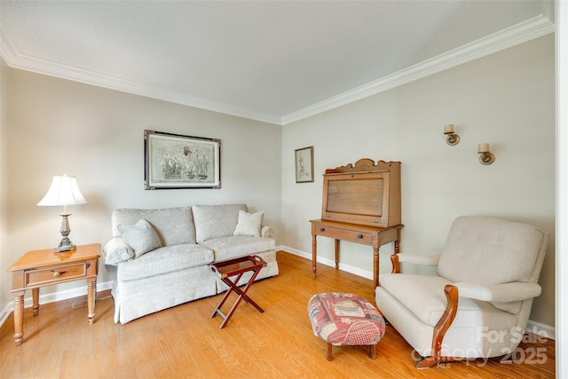 living room with crown molding, light wood finished floors, and baseboards