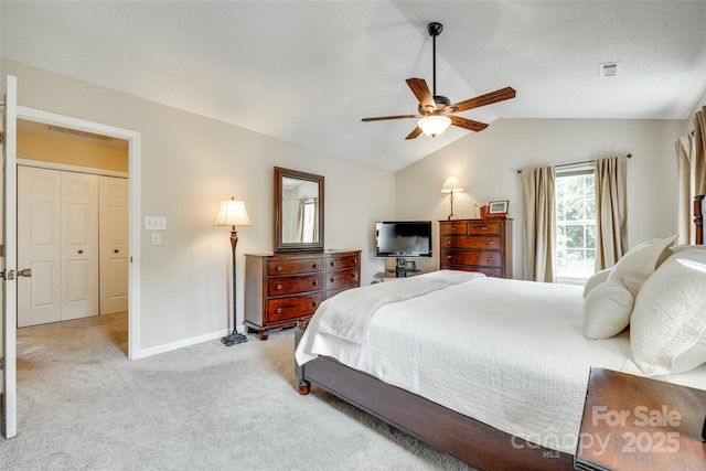carpeted bedroom featuring baseboards, visible vents, a ceiling fan, and vaulted ceiling