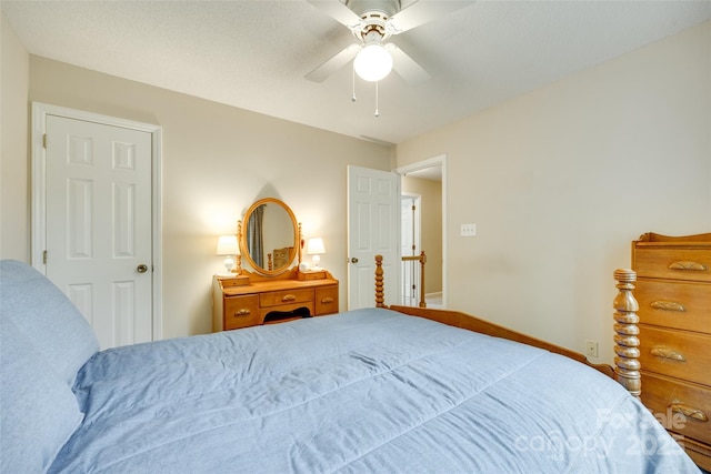 bedroom featuring a ceiling fan and baseboards