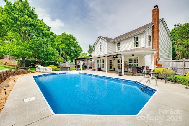 view of swimming pool with a fenced in pool, a patio area, and a fenced backyard
