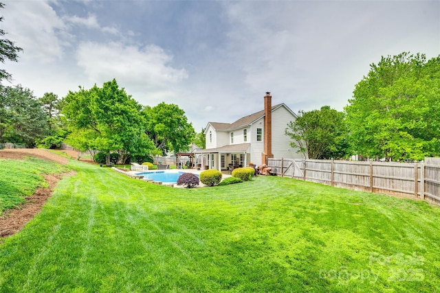 view of yard with a fenced backyard, a fenced in pool, and a patio area