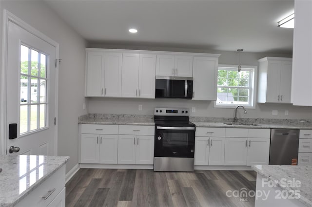 602 Still St Unit 1Blk C, Chester, SC 29706 - kitchen with stainless steel appliances, white cabinets, dark wood finished floors, and a sink