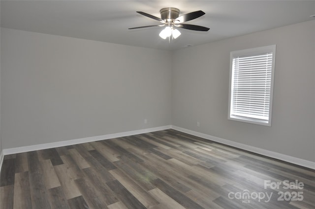 602 Still St Unit 1Blk C, Chester, SC 29706 - spare room with dark wood-style flooring, ceiling fan, and baseboards