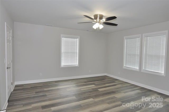 602 Still St Unit 1Blk C, Chester, SC 29706 - spare room with dark wood finished floors, a ceiling fan, visible vents, and baseboards