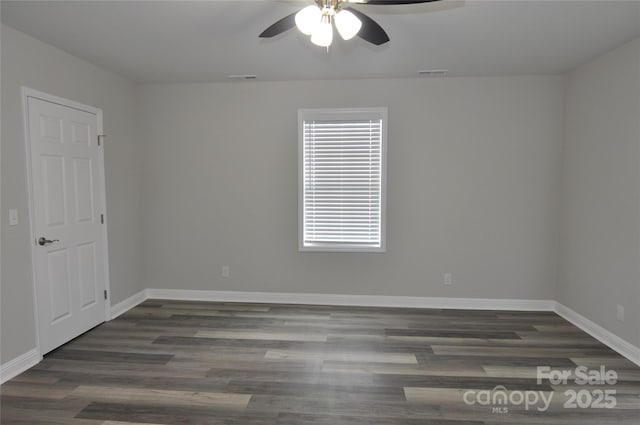 602 Still St Unit 1Blk C, Chester, SC 29706 - unfurnished room featuring dark wood-style flooring, visible vents, a ceiling fan, and baseboards