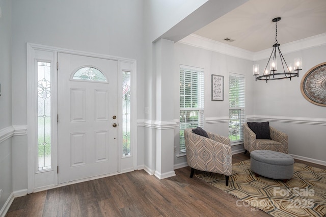 7905 Sedgebrook Dr E, Stanley, NC 28164 - entrance foyer with a chandelier, dark wood-type flooring, healthy amount of natural light, baseboards, and crown molding