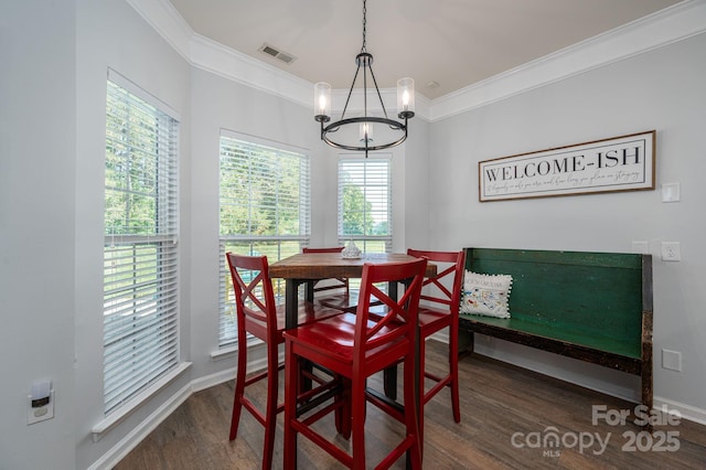 7905 Sedgebrook Dr E, Stanley, NC 28164 - dining room featuring a chandelier, wood finished floors, ornamental molding, and baseboards