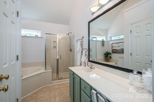 7905 Sedgebrook Dr E, Stanley, NC 28164 - bathroom with a garden tub, a stall shower, vanity, lofted ceiling, and tile patterned flooring