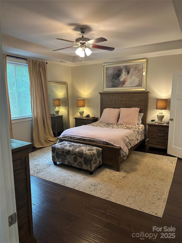 bedroom featuring ceiling fan and hardwood / wood-style flooring