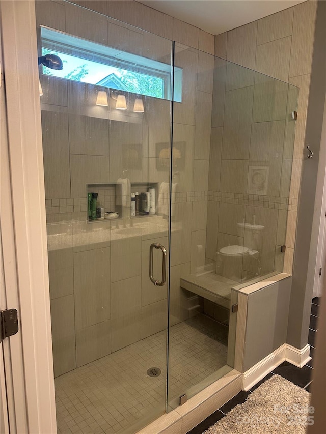 bathroom with a shower stall