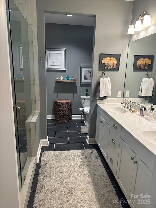bathroom with tile patterned flooring, a shower stall, double vanity, toilet, and a sink